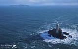 Fastnet Rock and Cape Clear 2.jpg - Fastnet Rock and Cape Clear during a visit in March ona beautiful sunny day but a changing sky and with a storm brewing