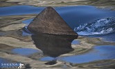 The Real Jaws (Basking Shark).jpg - I managed to shoot this photograph by going out to sea on a small boat which put me low to the water level and up close to a Basking Shark. It was a very calm day and you could clearly see the shark below the surface. I managed to get the right angle of light on the water to get this image. It shows the shark fin moving through the water surrounded by the reflection of the sky and cliffs above.