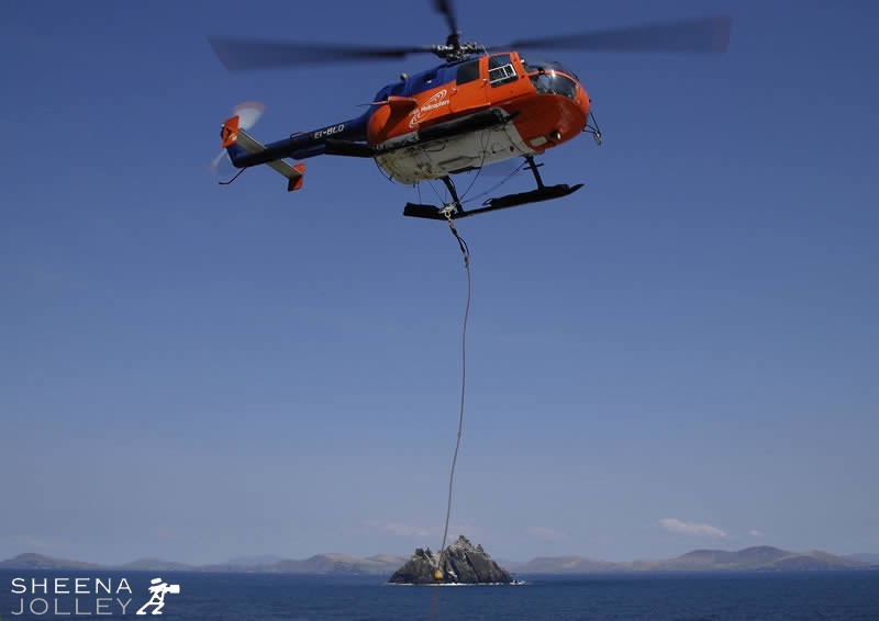 Irish Lights helicopter taking off from Skellig Michael with Little Skellig in the Background
