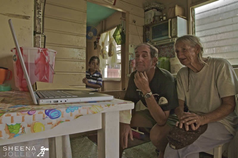 Wilson and Louise Yearwood and grandson Brent Alleyne looking on.Brent's brother and sister and parents live in the front of the house.